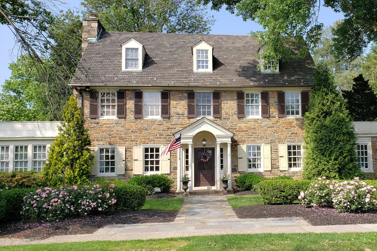 Brick two story Texas home with a landscaped front yard